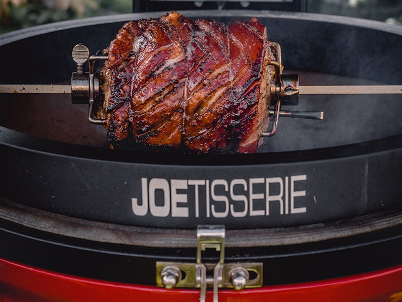 Succulent meat cooking on the Kamado Joe Joe-tisserie BBQ rotisserie sold across NZ.